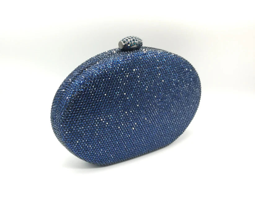 Borsetta da cerimonia rigida in strass color blu o rosa con tracolla interna removibile.