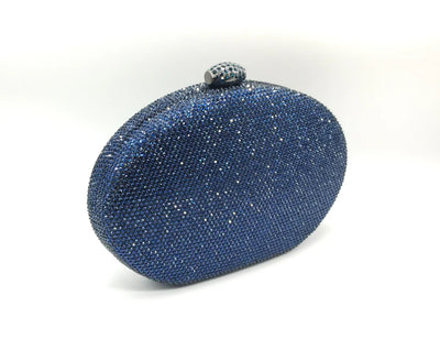 Borsetta da cerimonia rigida in strass color blu o rosa con tracolla interna removibile.