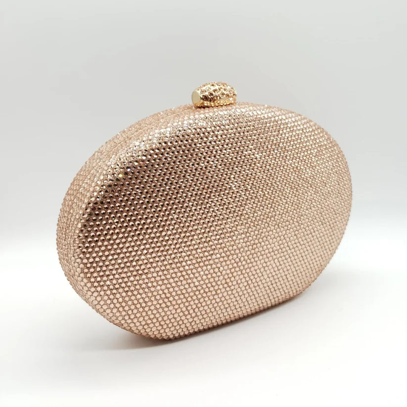 Borsetta da cerimonia rigida in strass color blu o rosa con tracolla interna removibile.