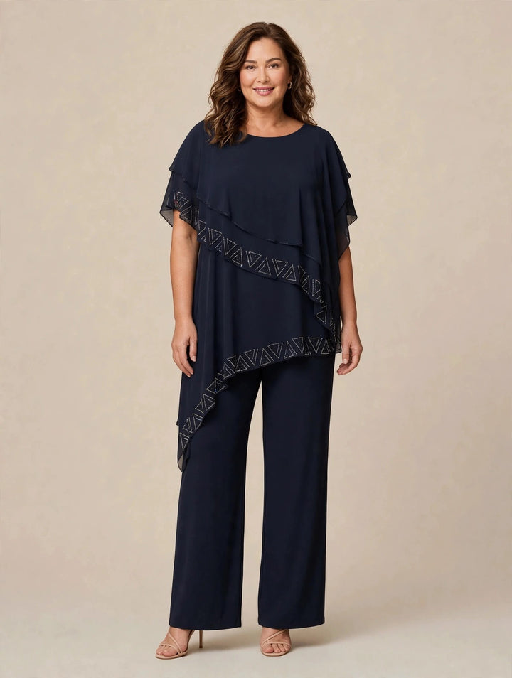 MERY LÒ - TUTA JUMPSUIT IN JERSEY CON PONCHO ASIMMETRICO IN CHIFFON E BORDI GEOMETRICI IN STRASS