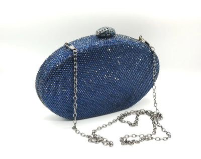 Borsetta da cerimonia rigida in strass color blu o rosa con tracolla interna removibile.