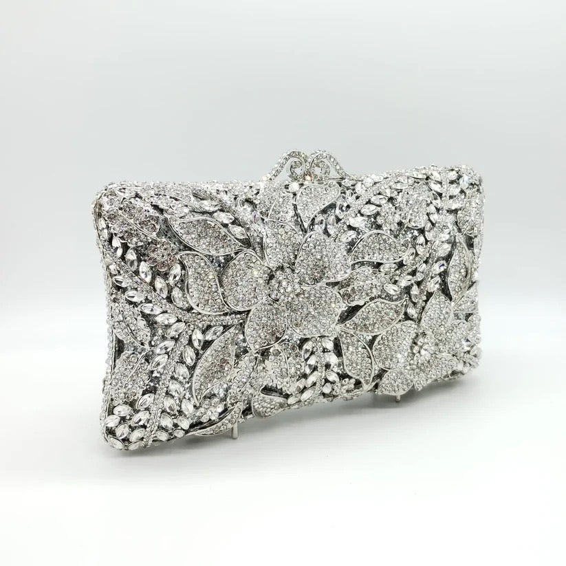 Borsetta gioiello color argento con zirconi crystal e tracolla interna removibile.