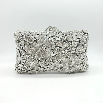 Borsetta gioiello color argento con zirconi crystal e tracolla interna removibile.