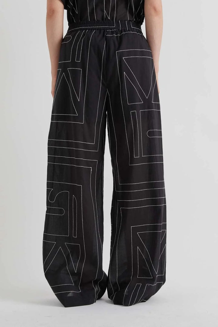 MEIMEI J - PANTALONE CON RICAMO LOGO ALL OVER