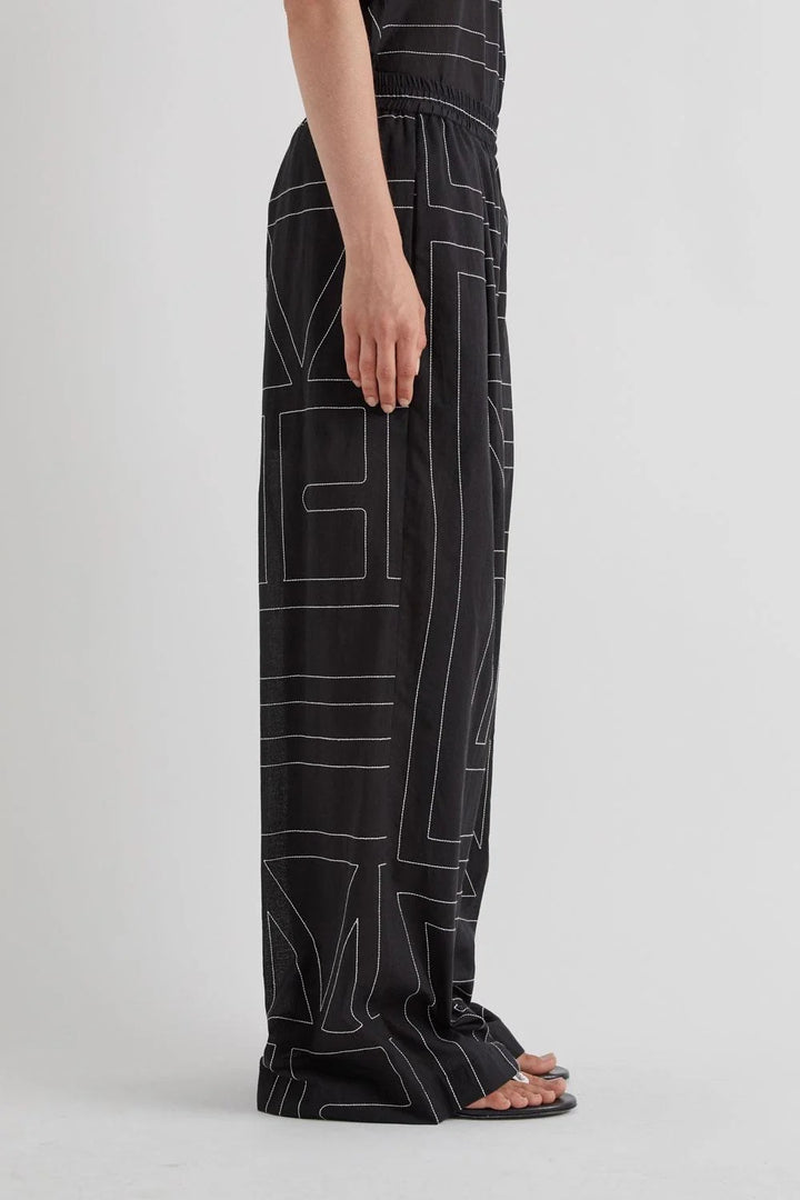 MEIMEI J - PANTALONE CON RICAMO LOGO ALL OVER