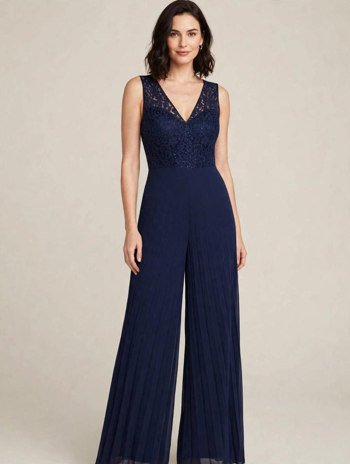 ANNA CAIAZZO - TUTA JUMPSUIT BLU NAVY CON CORPINO ILLUSION IN PIZZO CON STRASS A SCOLLO A V E PANTALONE WIDE-LEG IN CHIFFON PLISSÉ