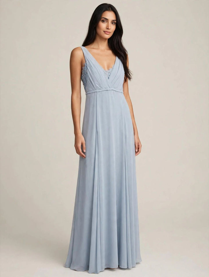 ANNA CAIAZZO - TUTA JUMPSUIT AZZURRO POLVERE CON CORPINO A V, RICAMI IN STRASS E PANTALONE IN PIZZO CON SOPRAGONNA IN CHIFFON